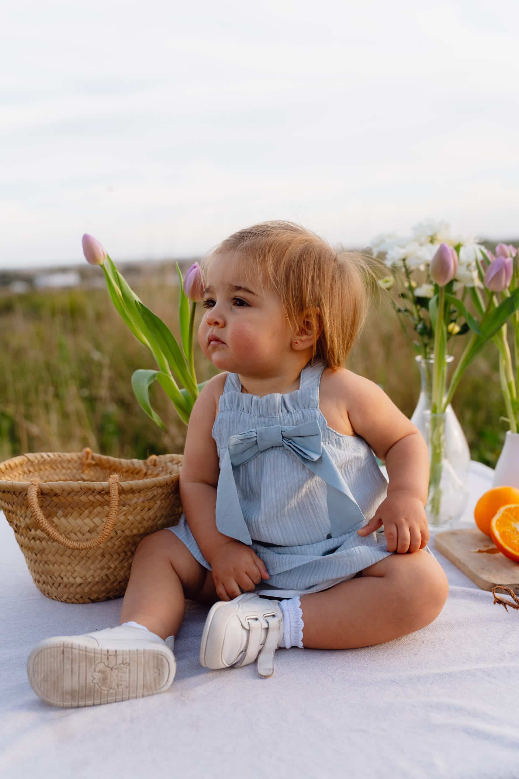 Vestido de bebe con braguita azul y lazo frontal