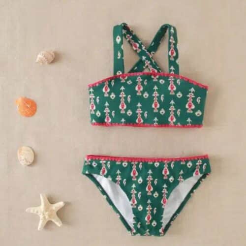 Bikini de niña con estampado geométrico y detalle fucsia
