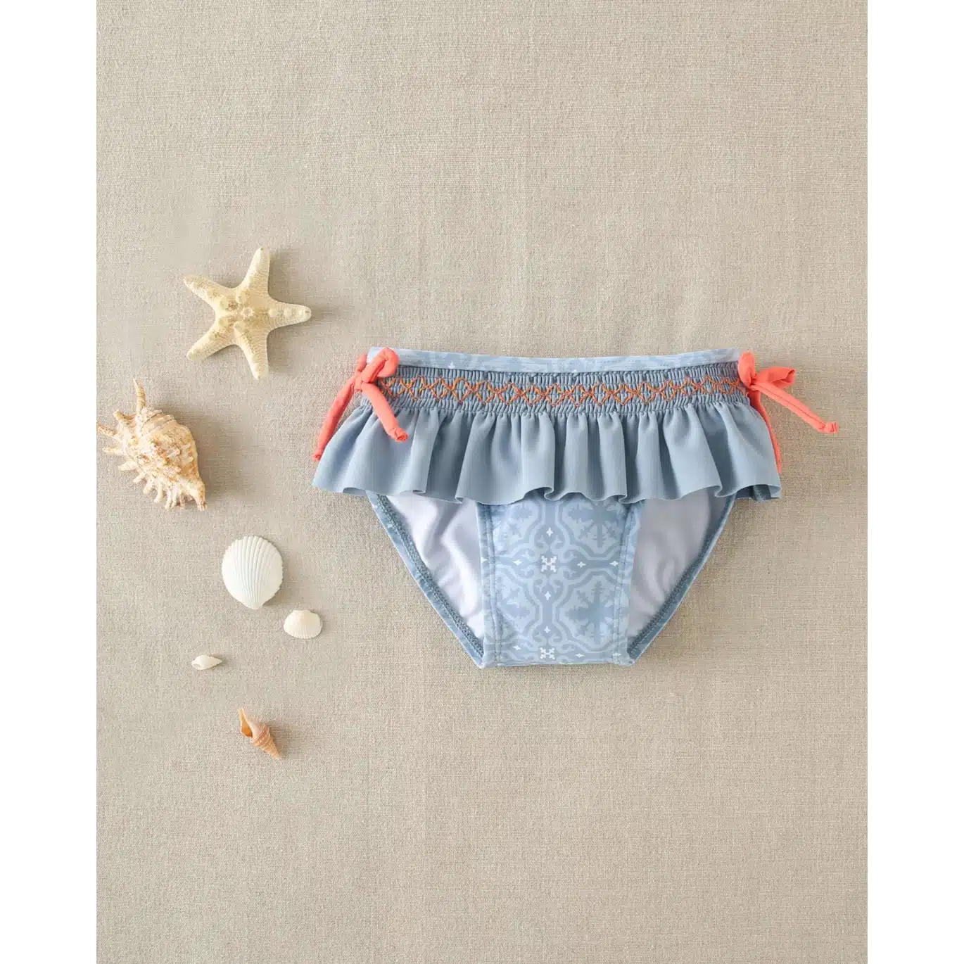 Culetín de bebe con estampado geometrico y detalle de lazos